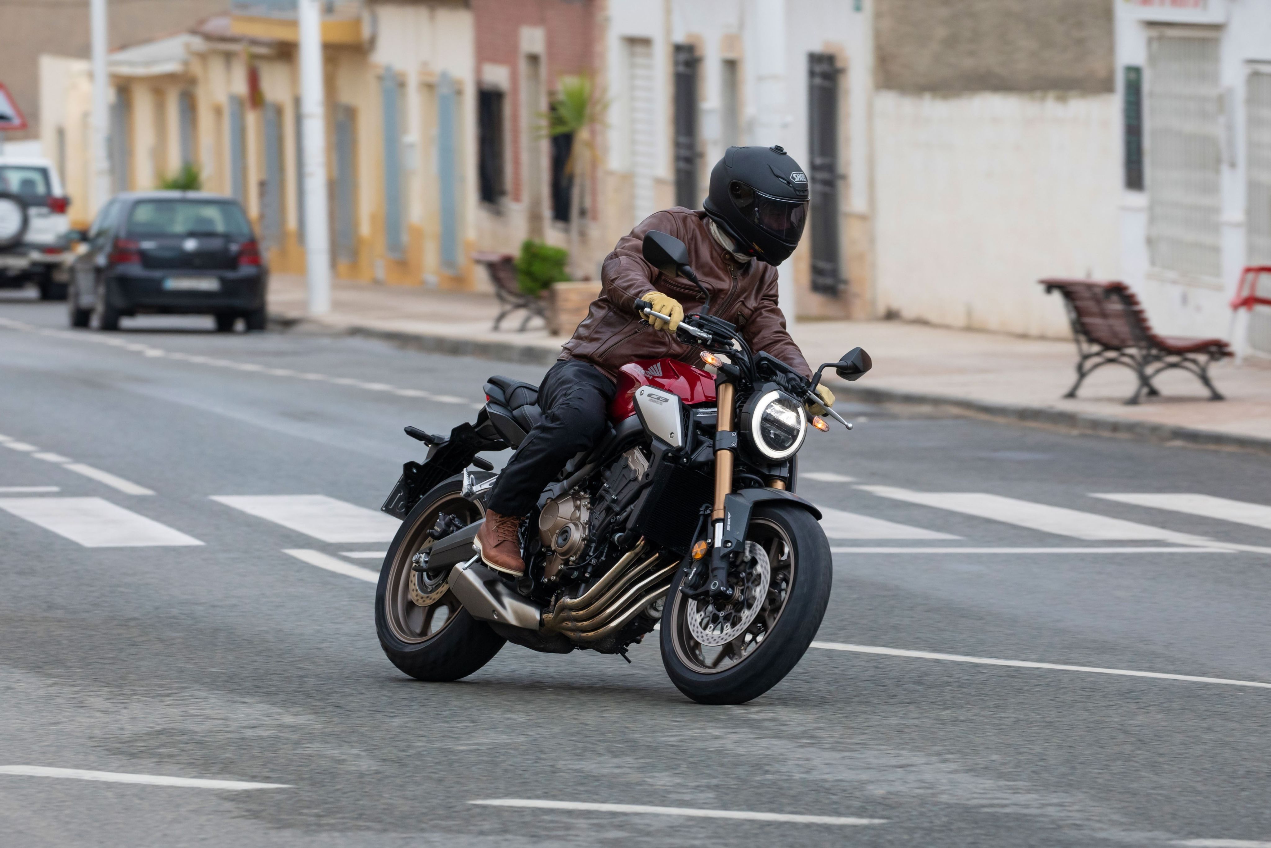 Man turning a corner on a motorcycle