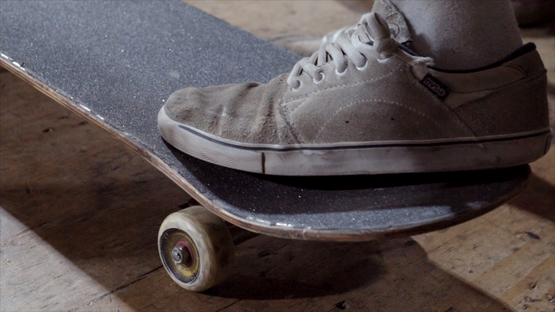 close up of skateboarders foot on board