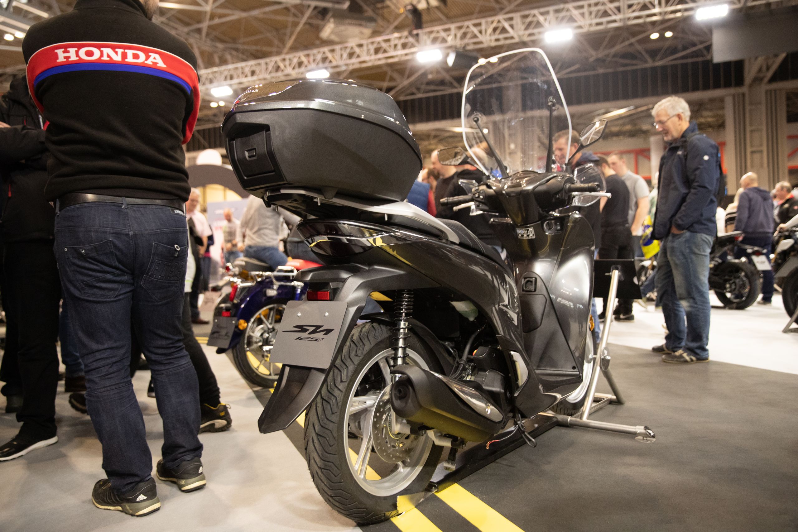 Rear side view of new, 2020 SH12i on stand at Motorcycle Live 2019