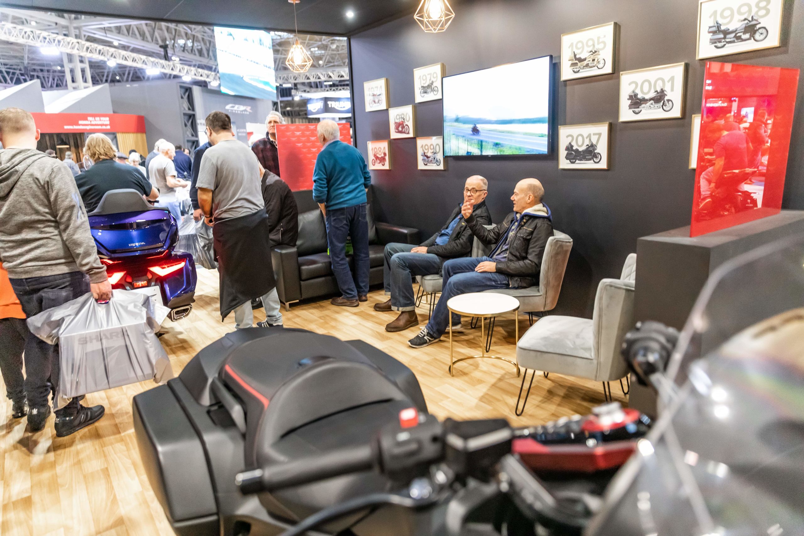 Photo of Motorcycle Live 2019 attendees in the Honda Gold Wing lounge