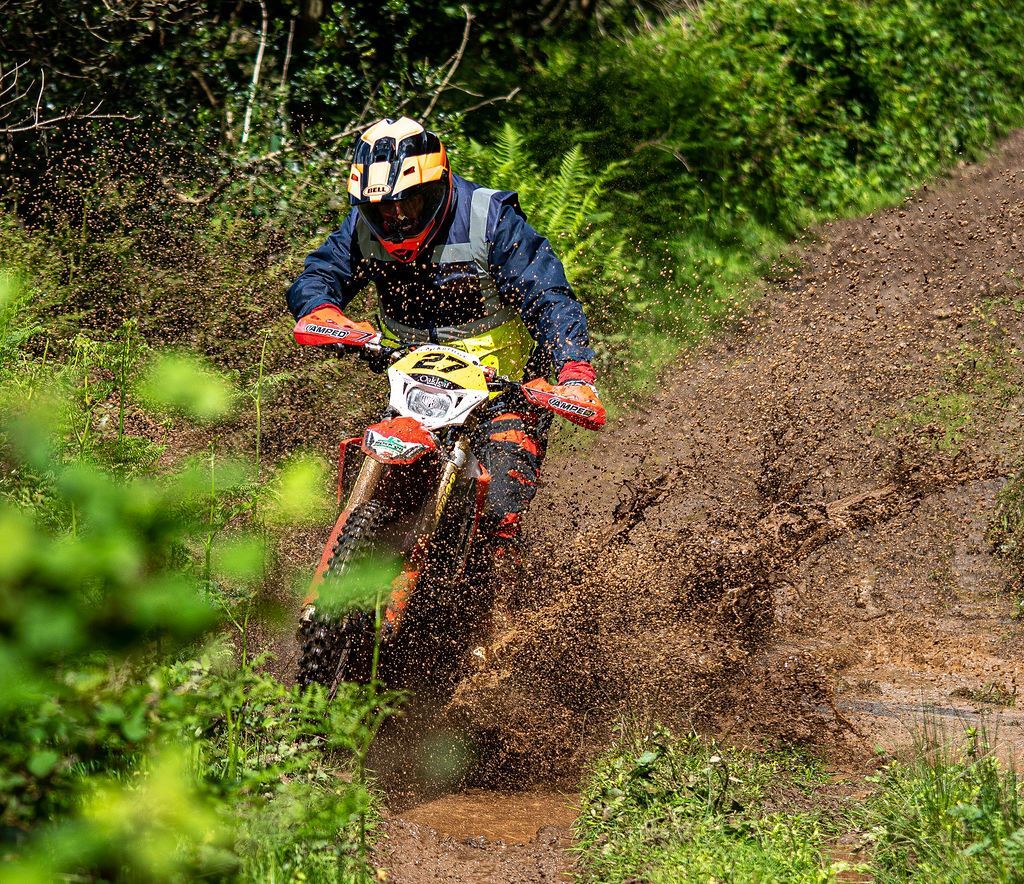 Rider sliding in mud on Honda off-road motorbike at the Dave Thorpe Off-Road Centre