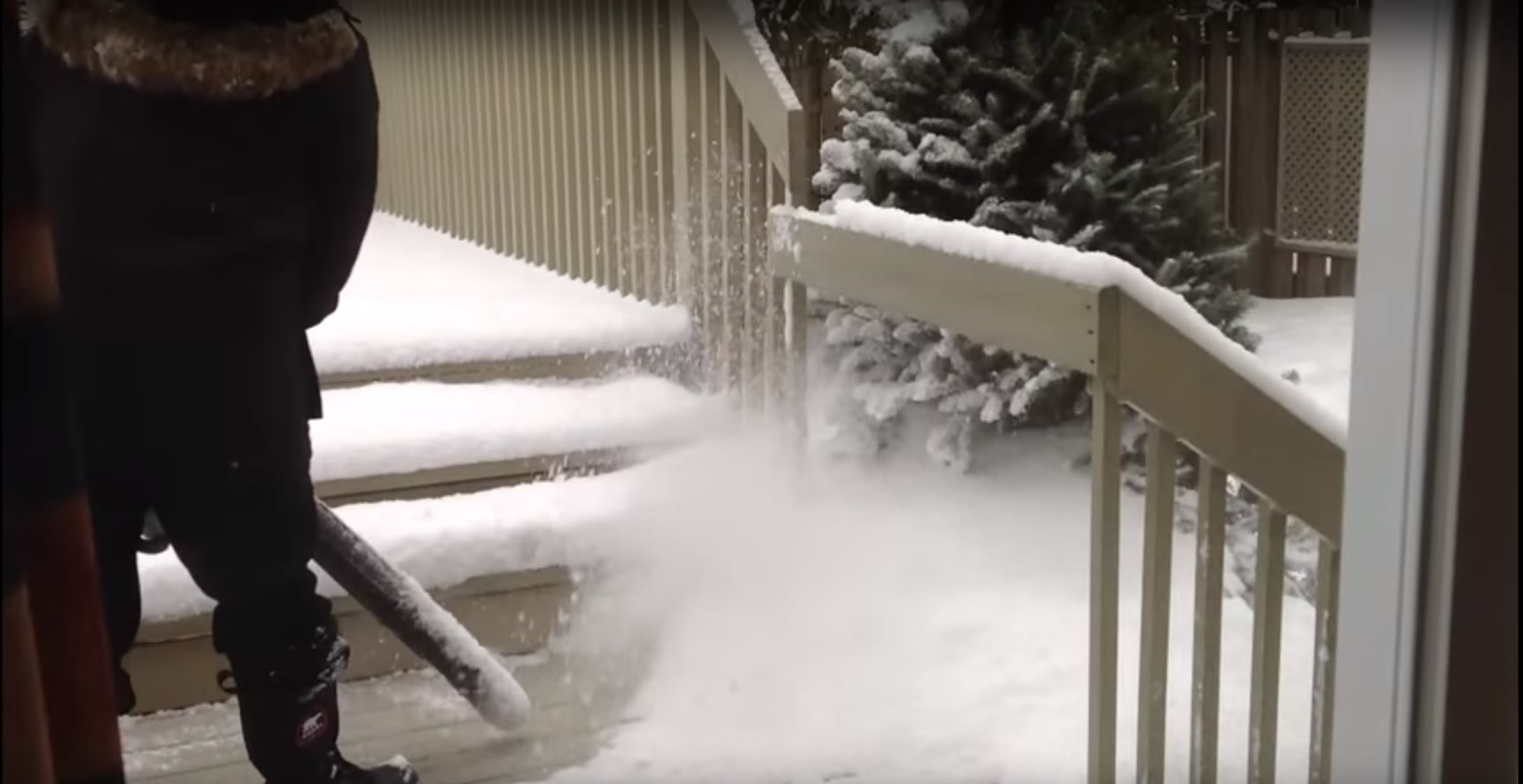 using a leaf blower to clear snow in winter