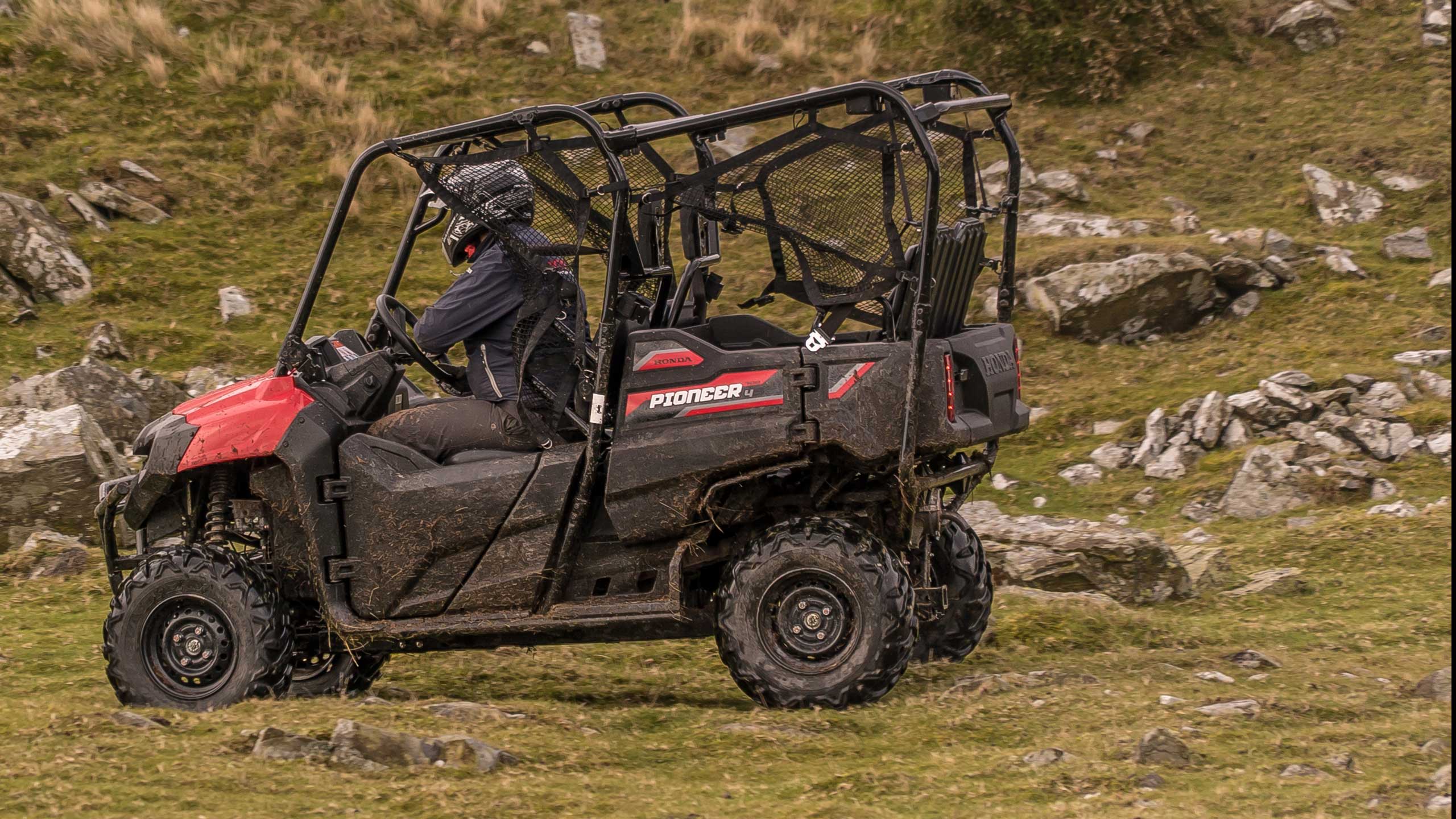 Honda Pioneer SXS 700 UTV 4 seater  in action
