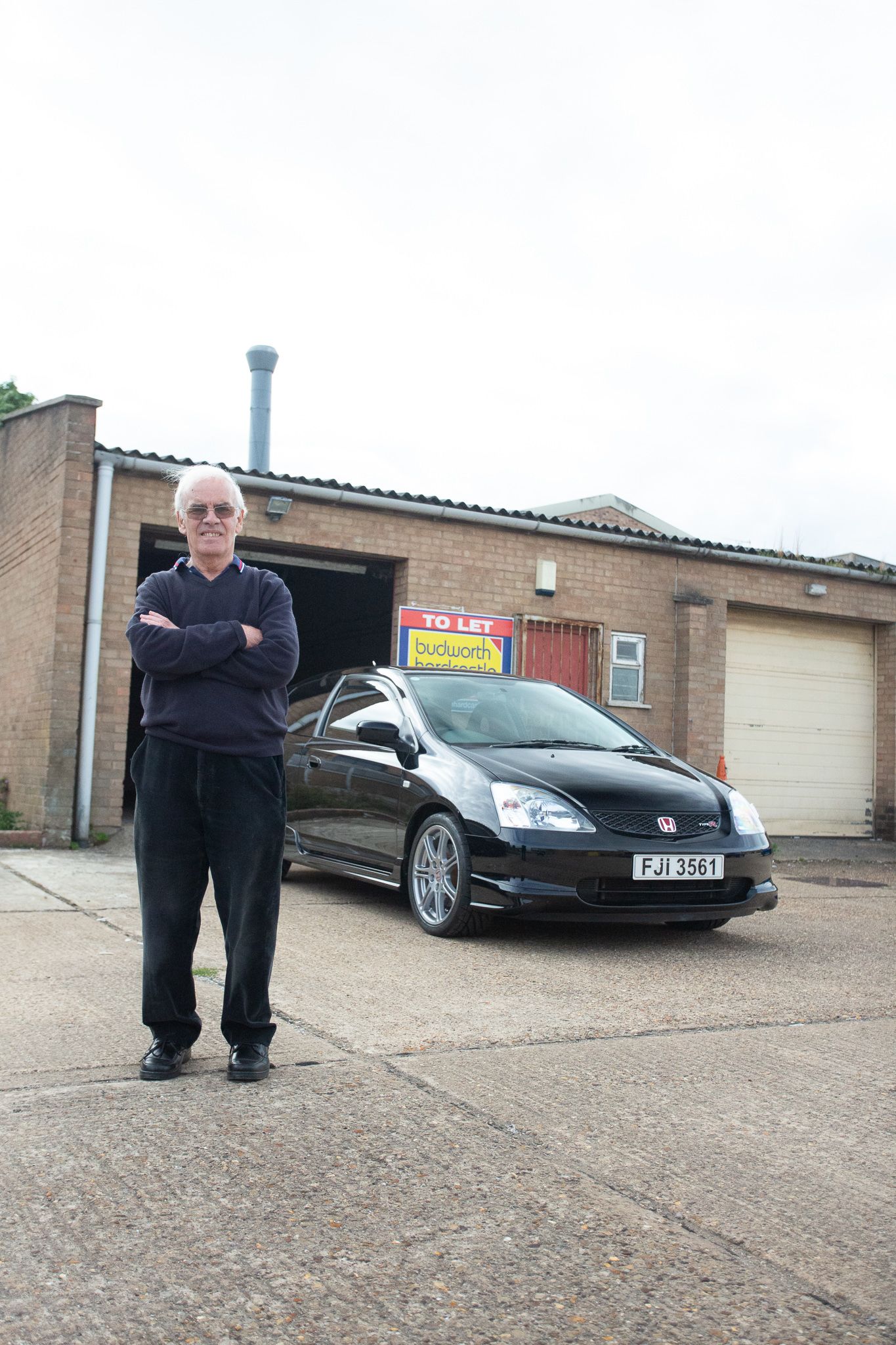 freddy mcgowna with his black honda civic type r ep3 outside his garage